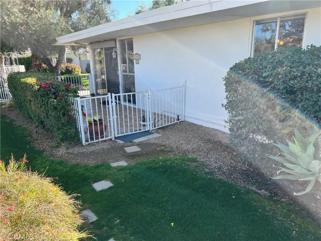 Entry gate towards the carport.