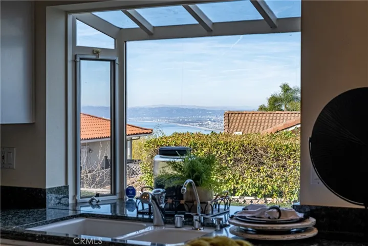 Doing dishes is not so bad when you have a Queens Necklace view to enjoy!