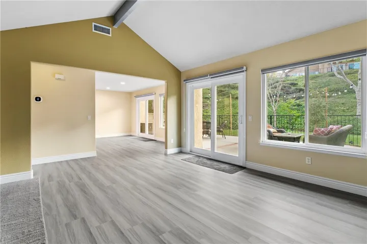 Large sliders and windows with nice views and abundant light.