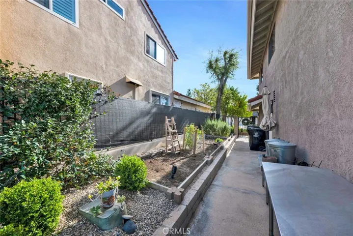 Side yard perfect for your garden!