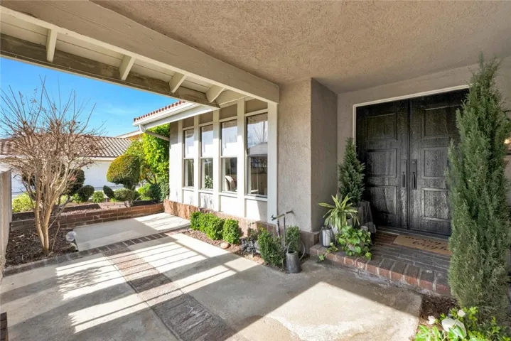 Front porch/patio with plenty of space for sitting area. Double door entry.