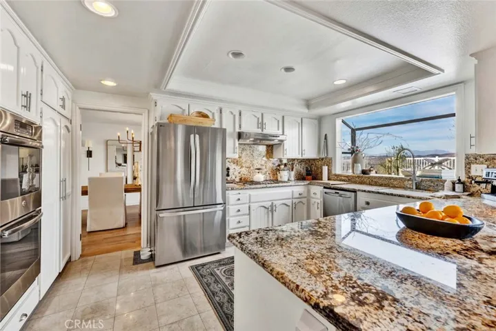 Kitchen situated between dining room and family room for perfect flow.