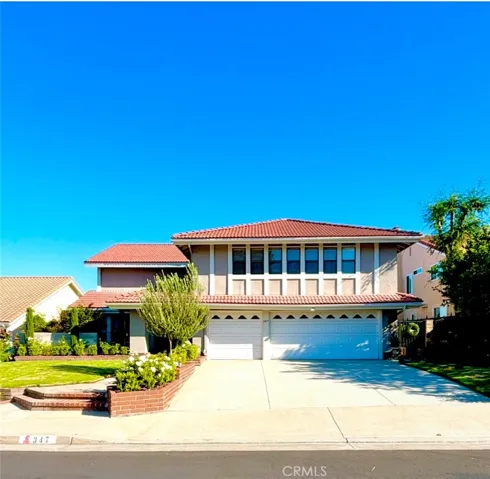 Extra long driveway! Great for parking plus 3 car garage!