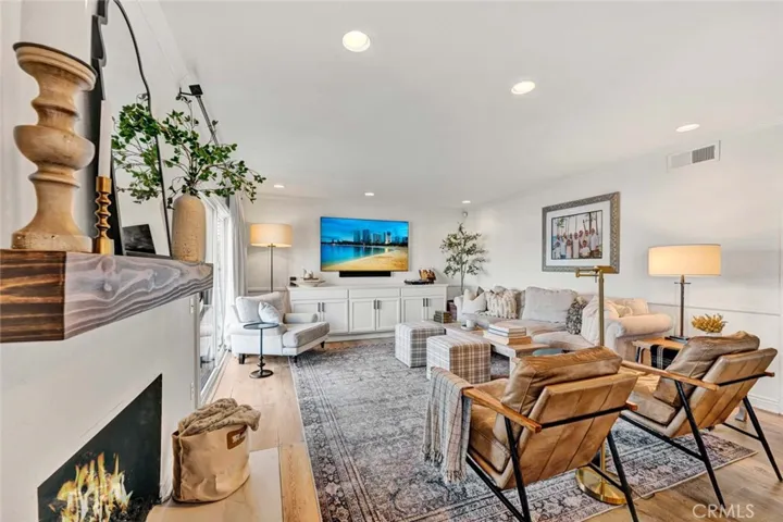 Cozy family room with remodeled fireplace and recessed lights.