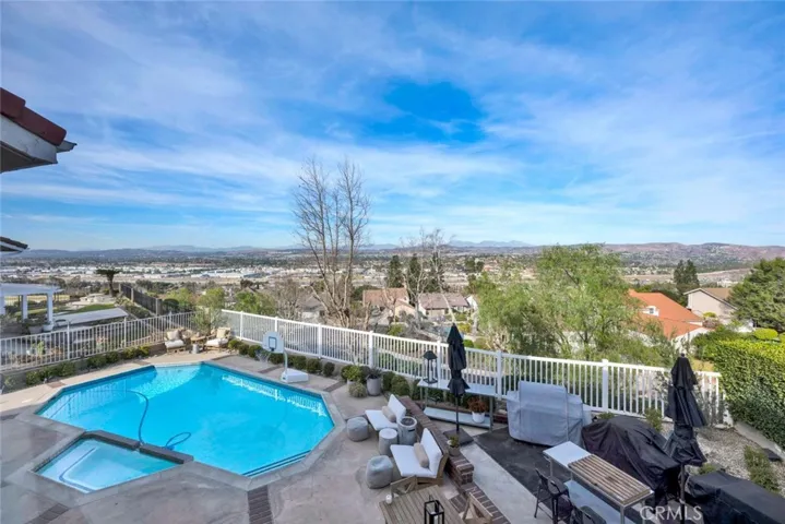 Resort style backyard with pool, spa, raised patio, sun deck and gorgeous views!