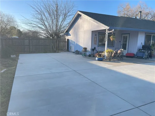 Concrete extended patio back of the house