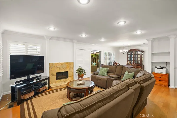 Gas fireplace, canned lighting, plantation shutters and wood floors!
