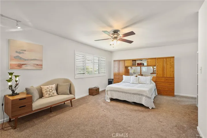 Plantation shutters, ceiling fan and newer carpet