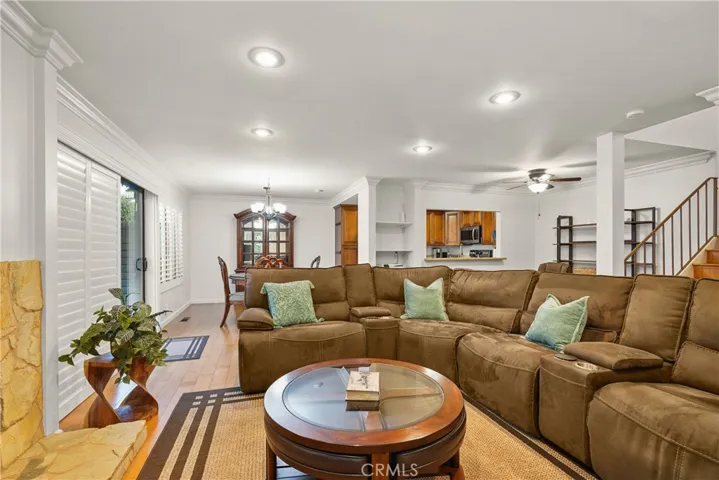 Living room with dining room and kitchen in background