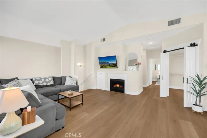 Warm fireplace and high ceilings in this living room