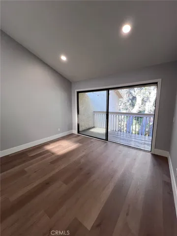 Primary bedroom suite with deck overlooking the stream.