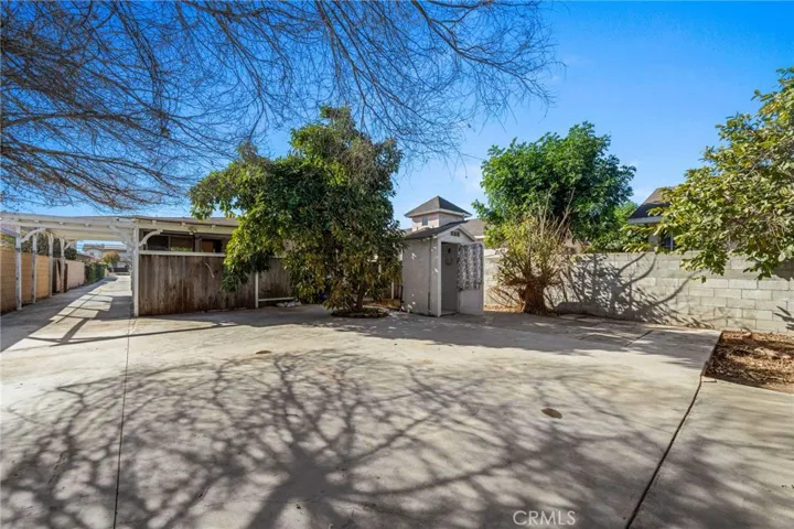 Facing front house and outhouse
