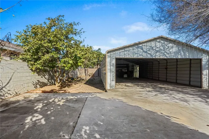 Behind the back house facinggarage