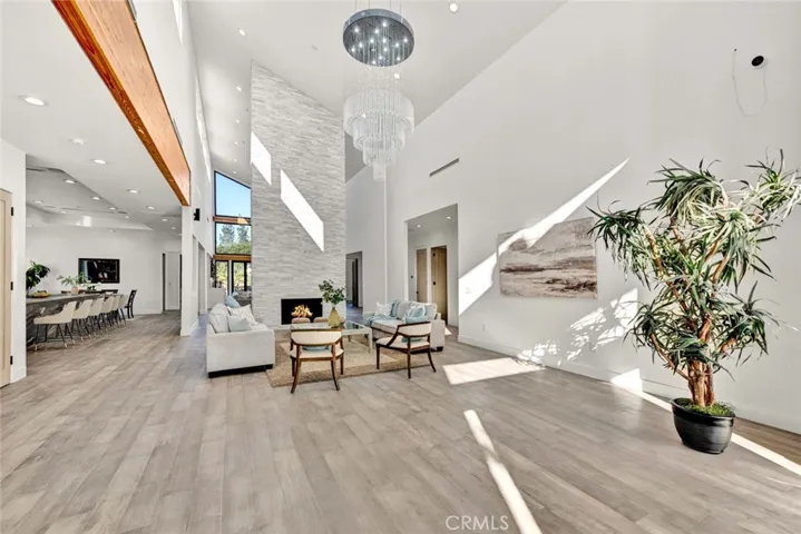 Step Inside to this Prenominal Custom-Built Masterpiece with Open Concept Floorplan with 26 Foot Soaring Ceilings