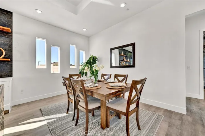 Full-size formal dining room is open to the kitchen and family room