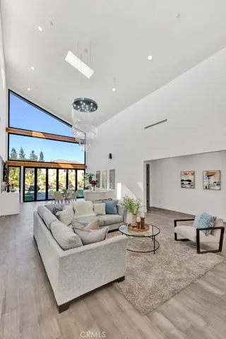 Family room also has 26 foot high ceilings with walls of glass