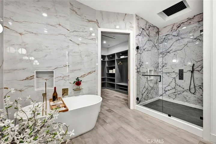 Primary Suite Luxurious Bathroom and Walk-in Closet with Custom Organizers
