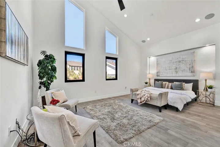 Primary Suite has Cathedral Ceiling, High Windows, Accent Lighting, Recessed Lighting, Ceiling Fan, a Giant Custom Organized Walk-In Closet and a Spa-Style Luxury Bathroom