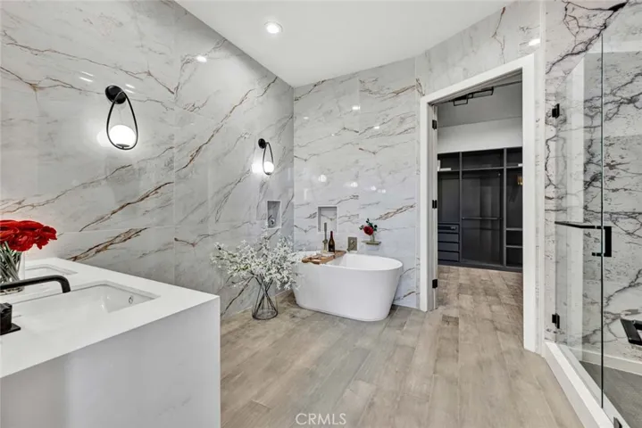 Primary Suite Bathroom is Total Luxury with Dual Sinks, Freestanding Soaking Tub, and Giant Separate Walk-In Shower with Multiple Shower Heads