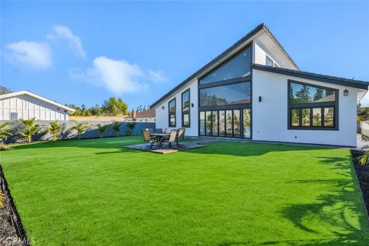 Giant Park-Like Back Yard with Patio, Artificial Turf, and Tropical Landscaping