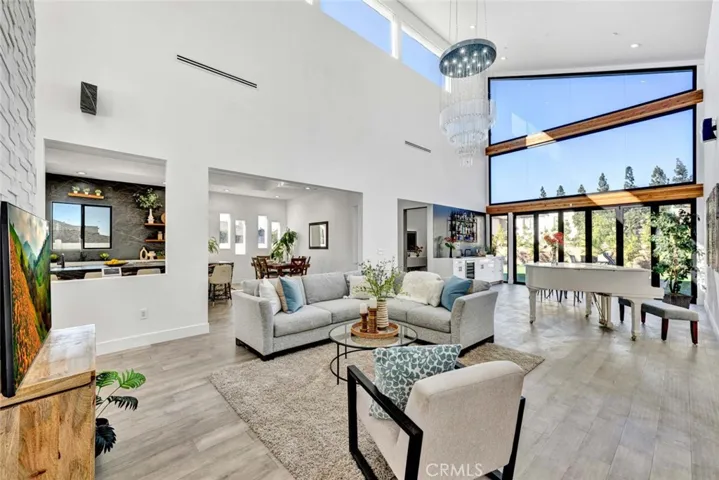 Giant family room with enormous windows and bi-folding doors that brings the outdoors in