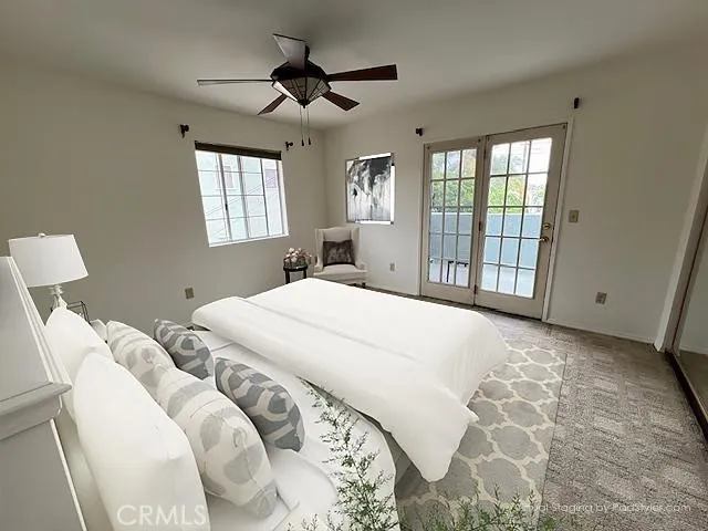 Virtually Staged 
Apartment, primary bedroom leading to terrace
