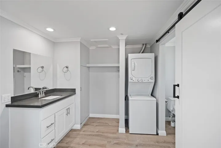 Master bathroom with stack washer and dryer