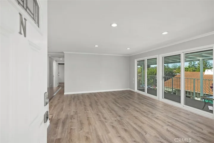 Open to a large living room with sliders to a balcony