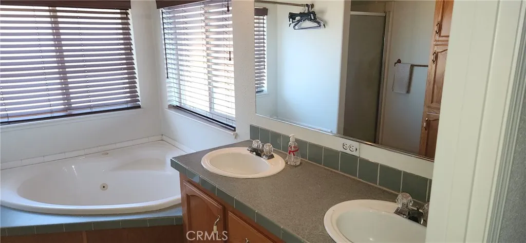 Main bathroom with dual sinks.