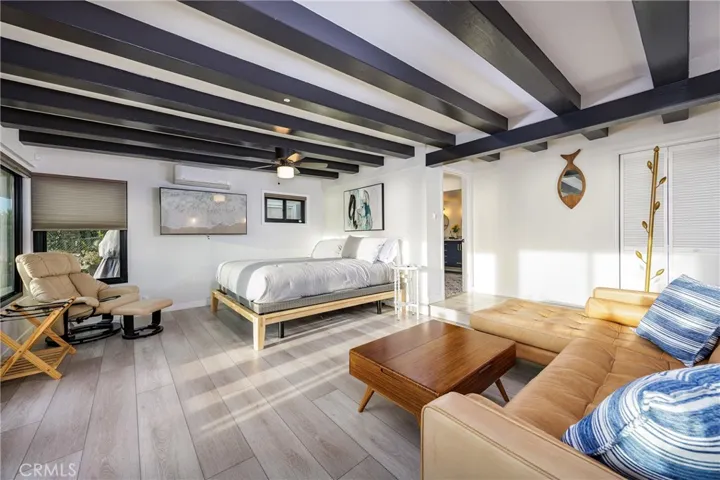 Primary suite has its own entrance and access to patio with ocean views