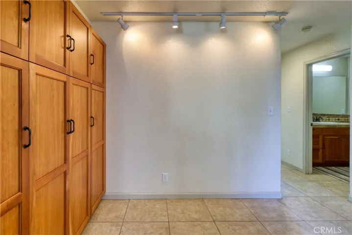 Wall of cabinets off kitchen