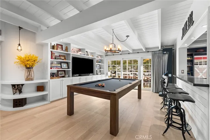 Game room with slider to backyard