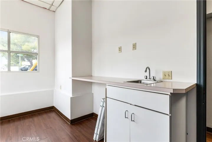 Corner office showing sink area