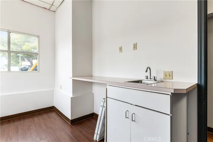 Corner office showing sink area