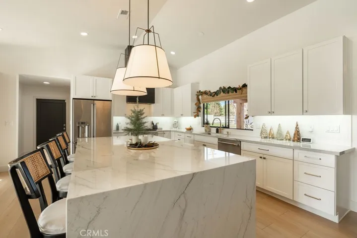 LARGE OPEN KITCHEN WITH WATERFALL ISLAND