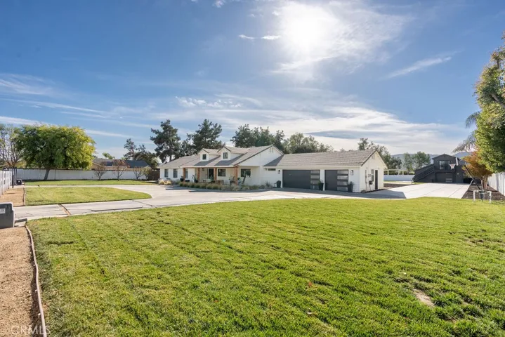 SIDE OF HOME SHOWING BARN IN BACK