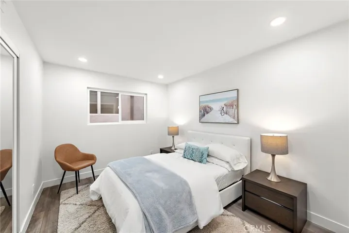 The four-bedroom, three-bath design continues with a mid-level hosting two secondary bedrooms.