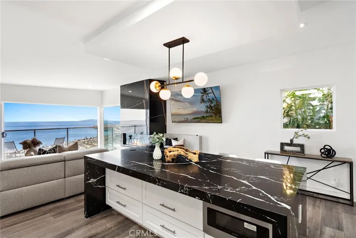 The main floor is designed for impressive entertaining and stylish daily living, with friends and loved ones enjoying a living room and kitchen that flow directly to a view balcony.