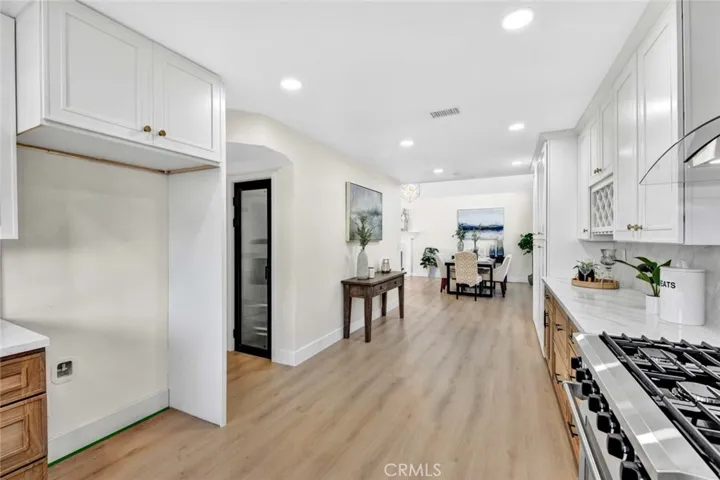 Walk-in pantry in gourmet kitchen