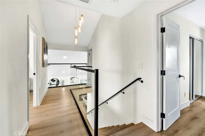Upstairs landing area with clear glass railings