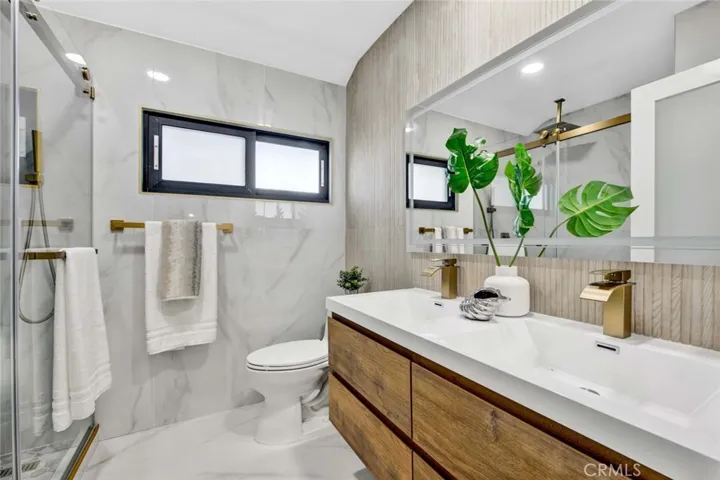 Luxurious all Marble guest bathroom with dual sinks