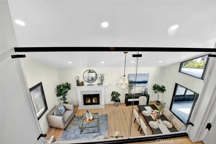 Clear glass railings with views to living room below