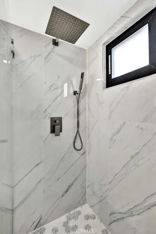 Marble surround and multiple shower heads