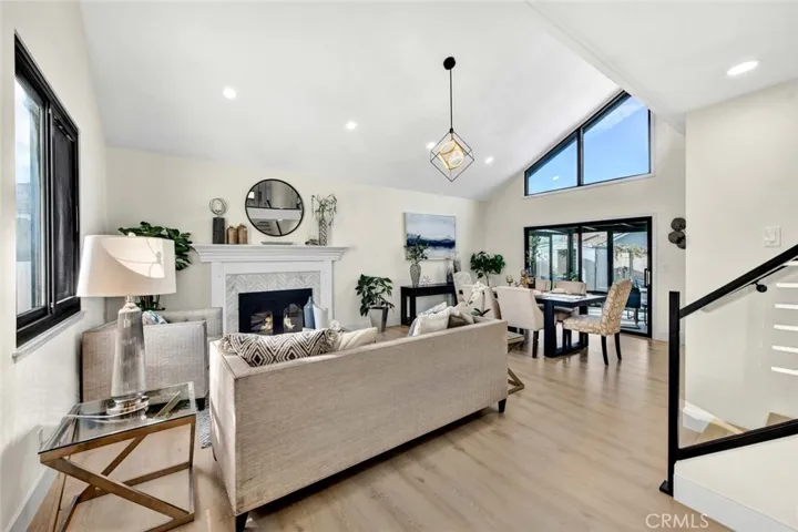 Soaring Ceilings, Waterproof Wood Vinyl Flooring, Dual Pane Windows, Extensive LED Recessed Lighting, Marble Firepace with Handcrafted Mantel and Surround