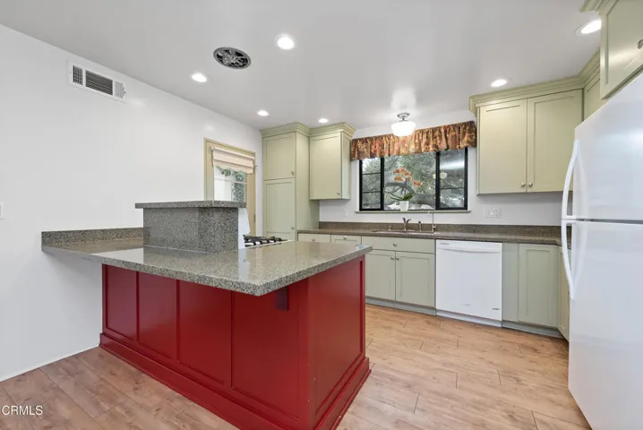 Gas range, dishwasher and nice cupboards