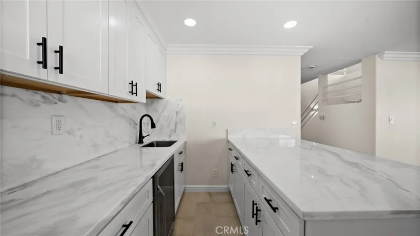 Wet Bar with under cabinets LED lights under cabinets, beverage/Wine Cooler and bar counter.
