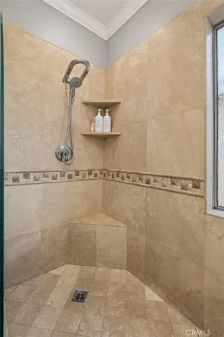 This is a view of the tiled walk-in primary shower
