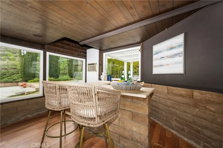 Bonus room with a bar and backyard view
