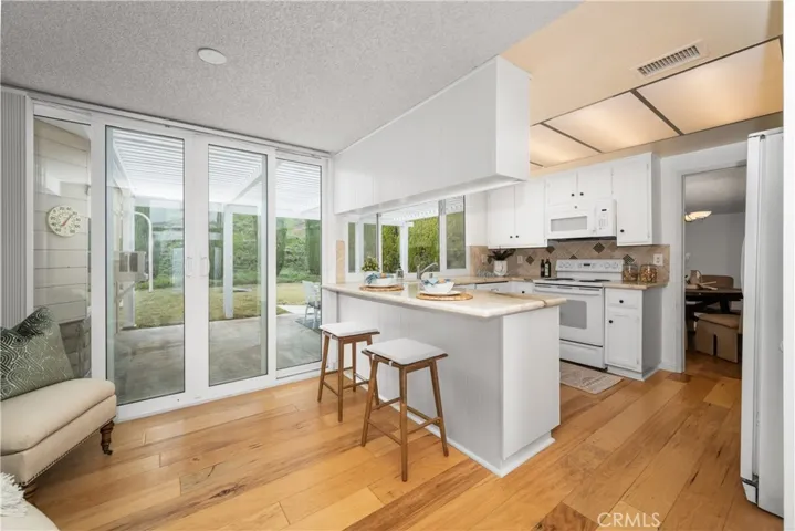 kitchen view to back yard and dining room