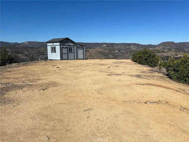 GROUND LEVEL VIEW FROM CAMARON ROAD ENTRY ACROSS FUTURE HOME SITE INTO STORAGE SHED AREA  GREAT VIEWS!